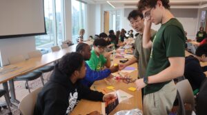 More students work on hands-on innovation design.