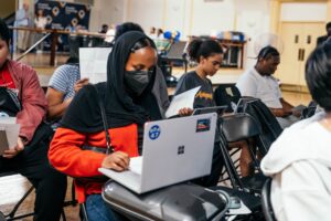 Students learn how to navigate their laptops.