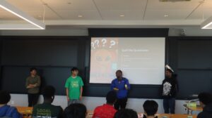 In groups, students present their innovation designs at Tufts University.