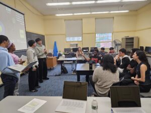 Students participate in an activity emulating Shark Tank.